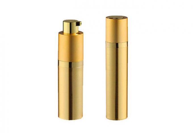 Goldene zylinderförmige kosmetische Vakuumpumpflasche